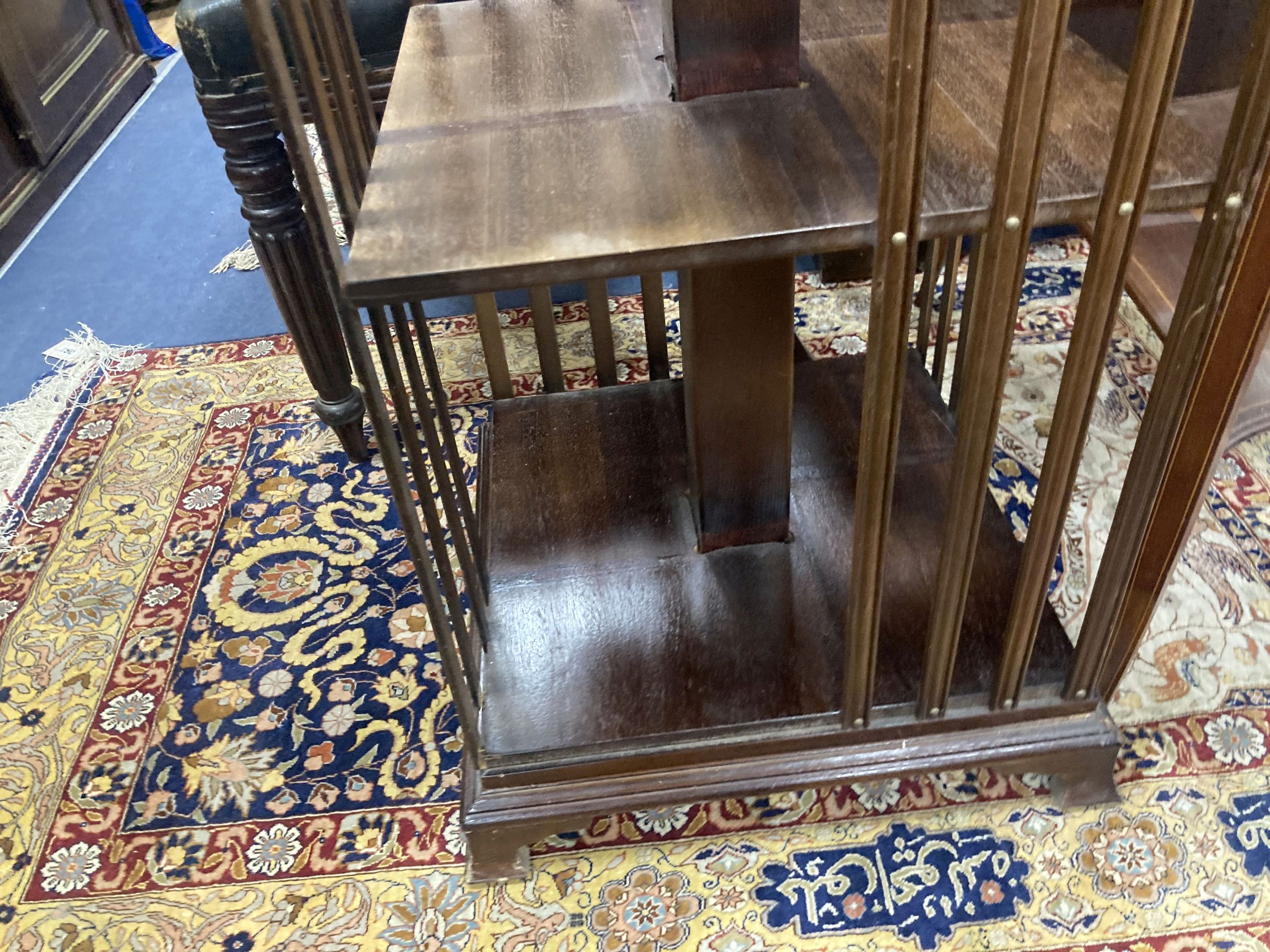 A reproduction inlaid mahogany revolving bookase, width 43cm, height 82cm
